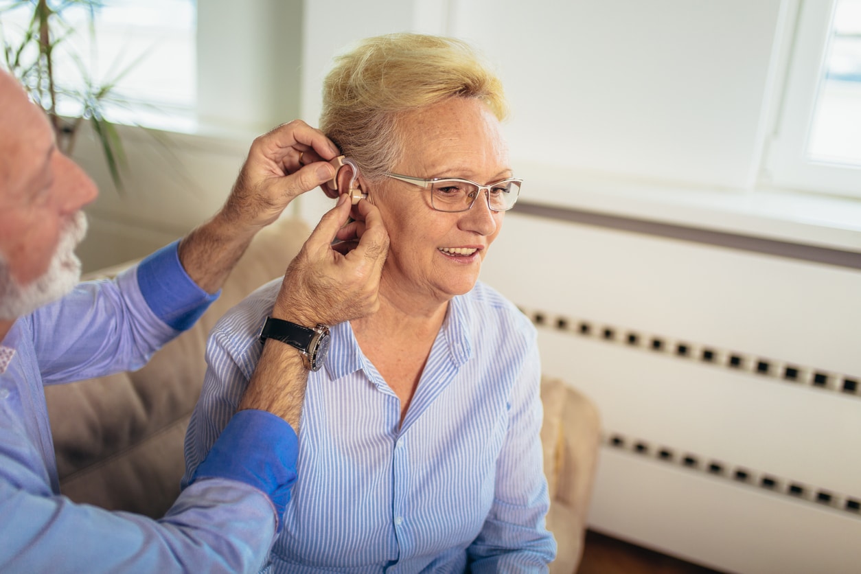 Woman is fitted with hearing aid