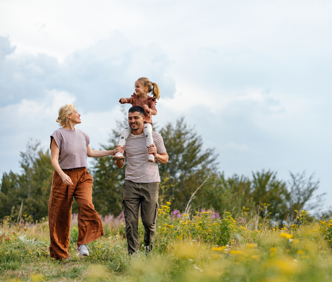 Happy Family Enjoying a Nature Walk in the Countryside